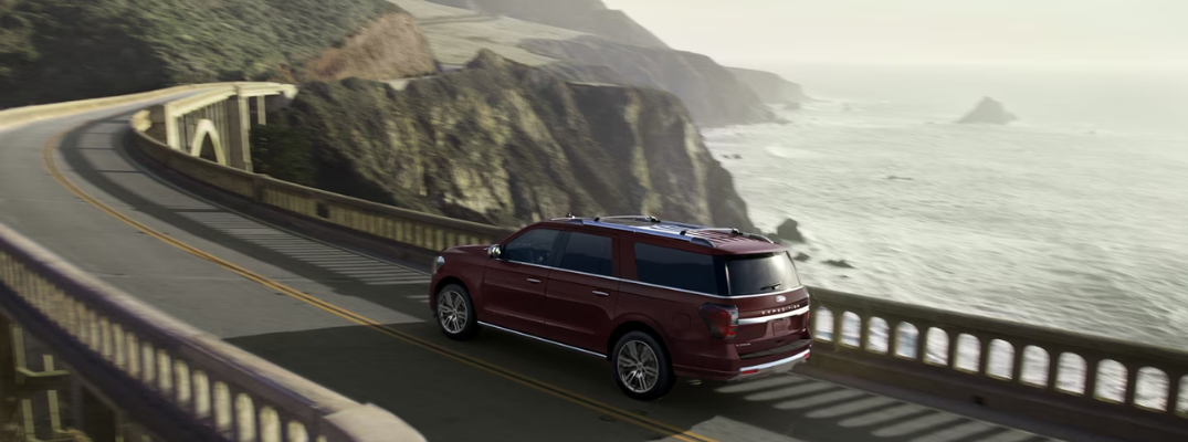 2024 Ford Expedition driving down a winding bridge